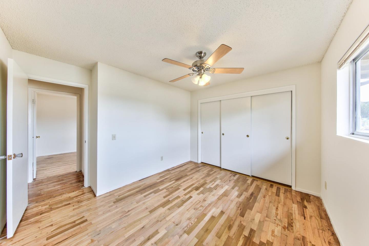3283 Michael Drive Marina, CA 93933 - Photo 18 of 19 wooden floor in an empty room with a window