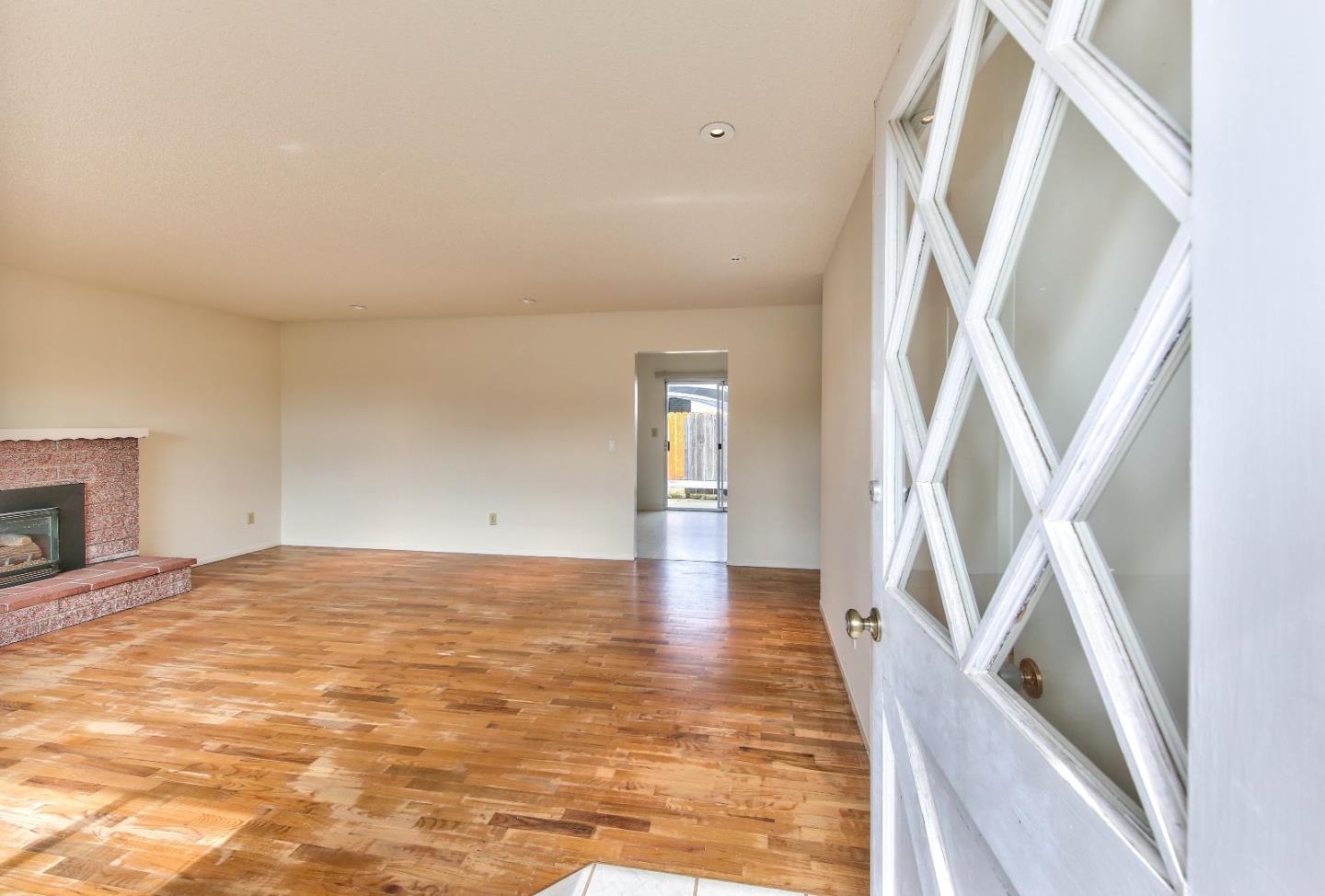3283 Michael Drive Marina, CA 93933 - Photo 2 of 19 a view of an empty room with stairs and a fireplace