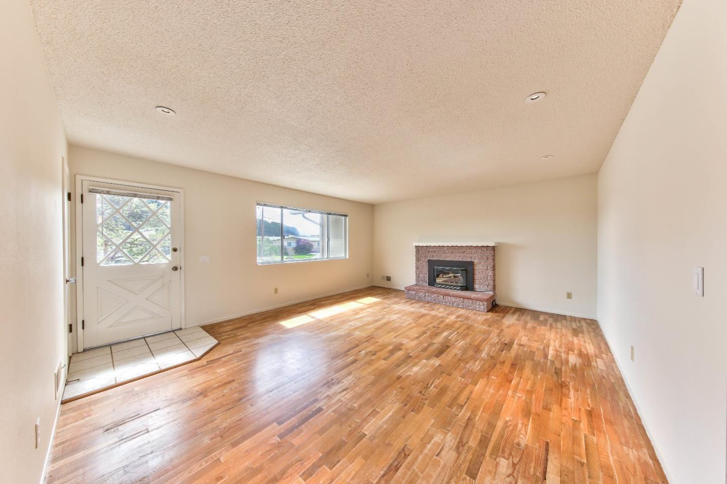 3283 Michael Drive Marina, CA 93933 - Photo 3 of 19 a view of empty room with wooden floor and fan