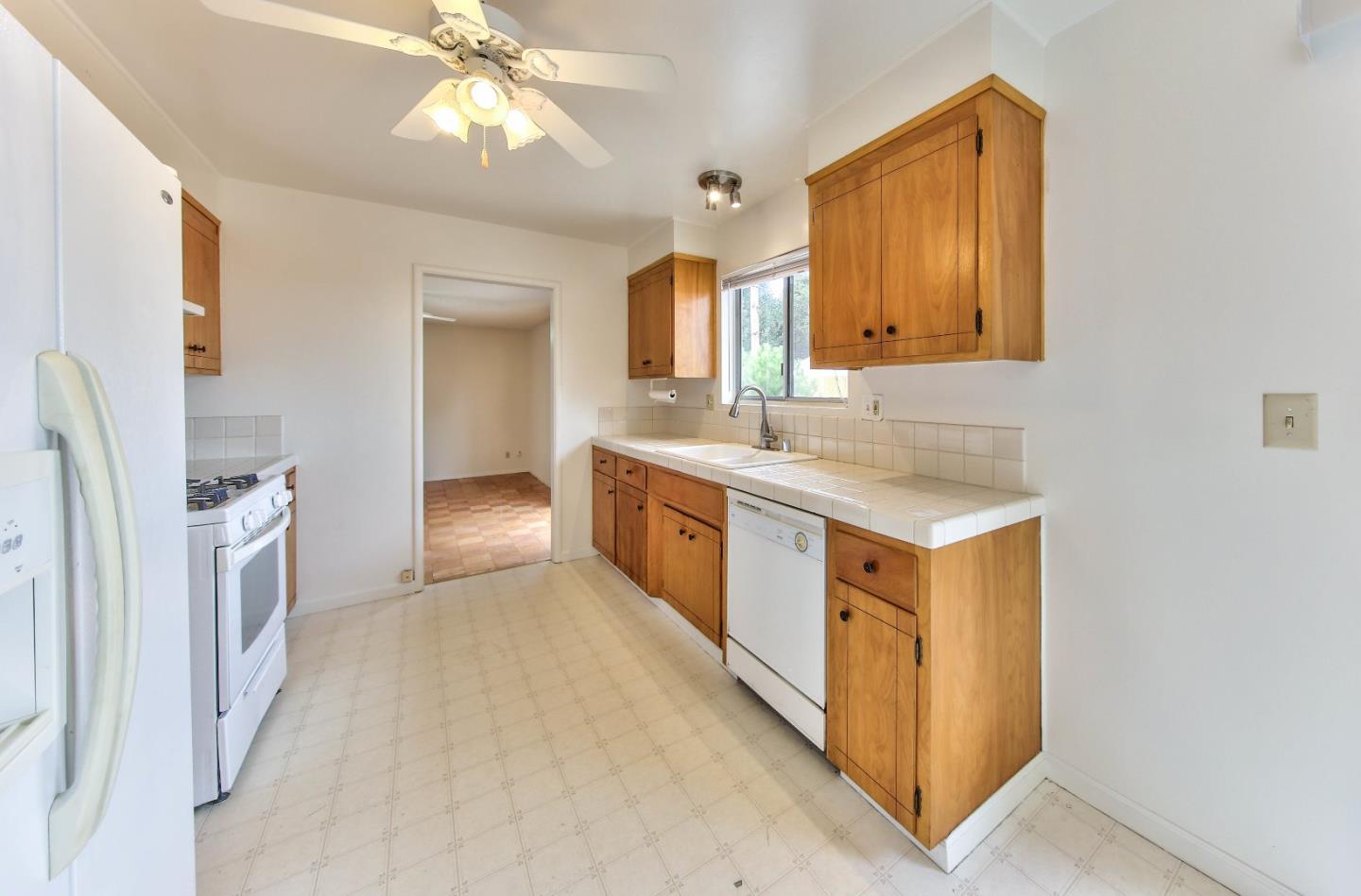 3283 Michael Drive Marina, CA 93933 - Photo 8 of 19 a view of a kitchen with a sink and a window