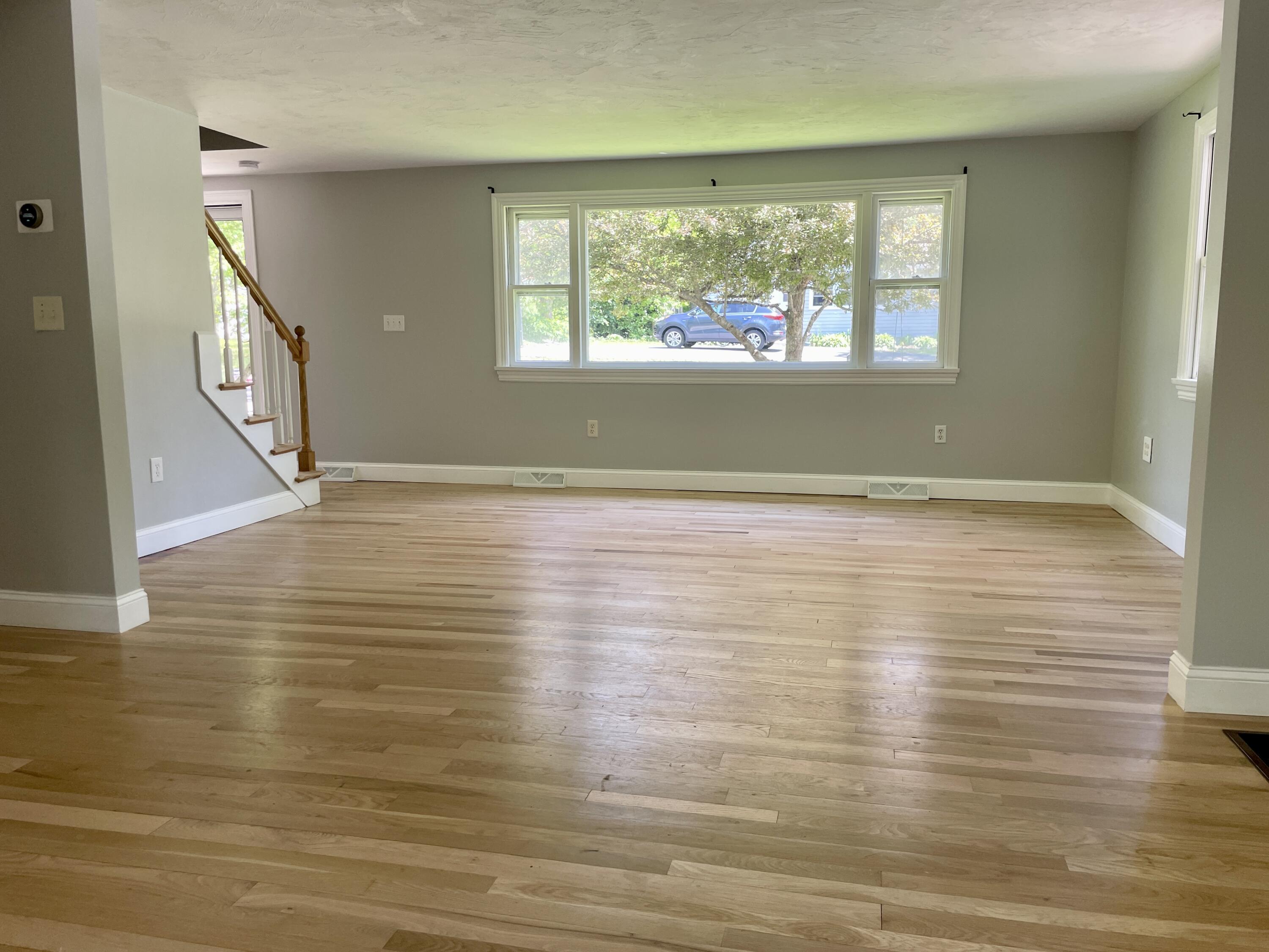 42 Forest Drive Mashpee, MA 02649 - Photo 10 of 55 an empty room with wooden floor and windows