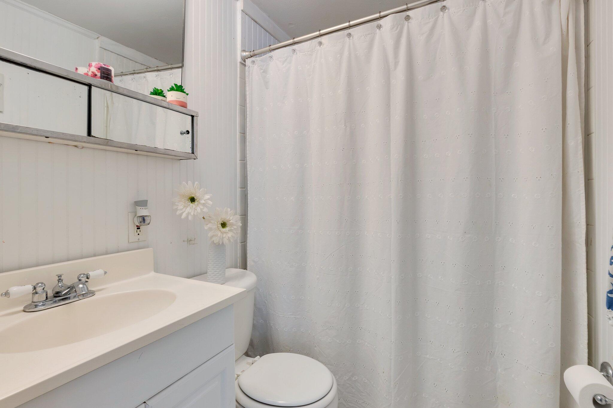 42 Forest Drive Mashpee, MA 02649 - Photo 12 of 55 a bathroom with a sink and a mirror