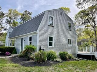 42 Forest Drive Mashpee, MA 02649 - Photo 14 of 55 a view of a house with a yard and plants