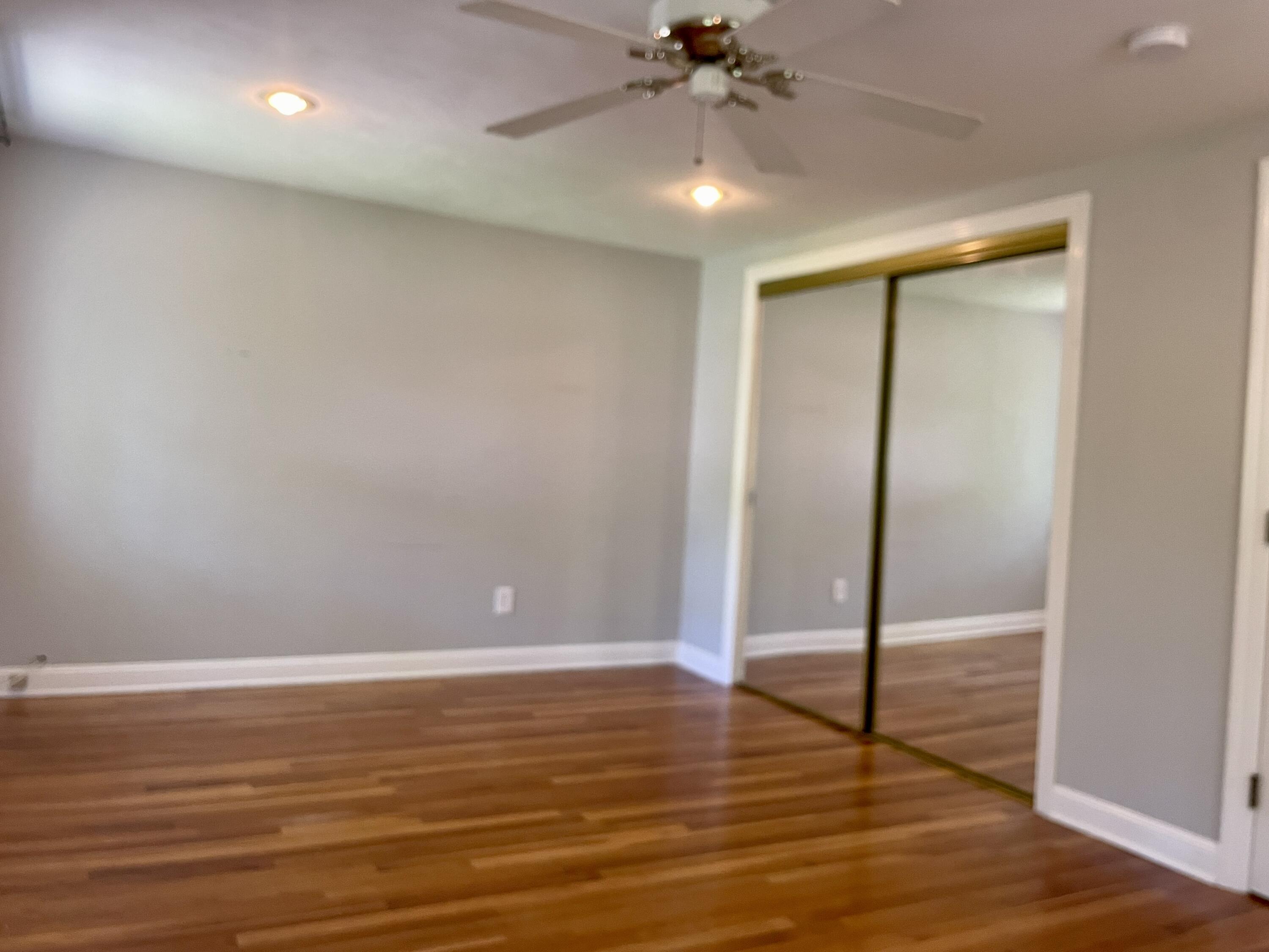 42 Forest Drive Mashpee, MA 02649 - Photo 18 of 55 a view of an empty room with wooden floor