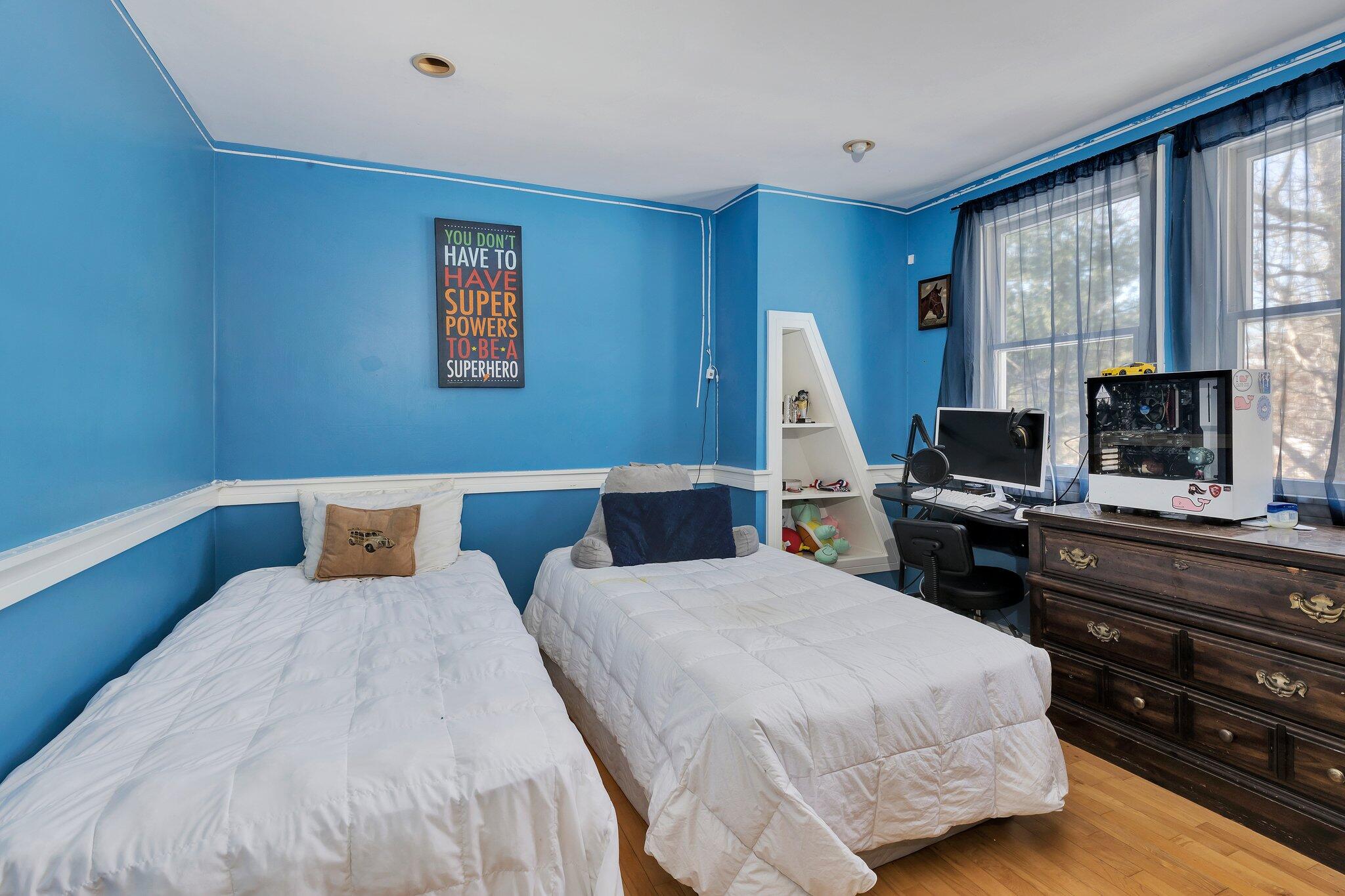 42 Forest Drive Mashpee, MA 02649 - Photo 25 of 55 a bedroom with a bed and wooden floor