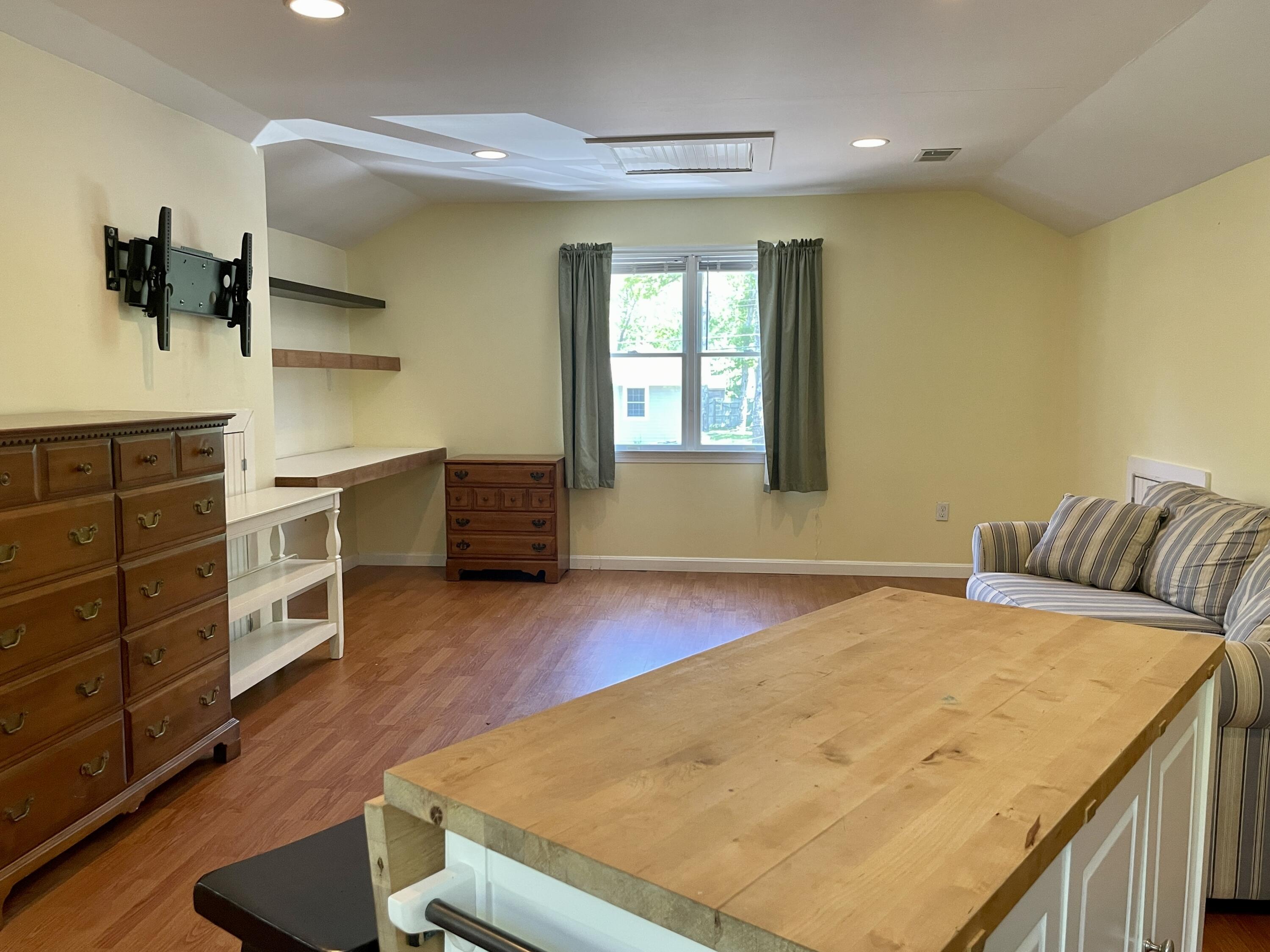 42 Forest Drive Mashpee, MA 02649 - Photo 32 of 55 a bedroom with a bed and furniture