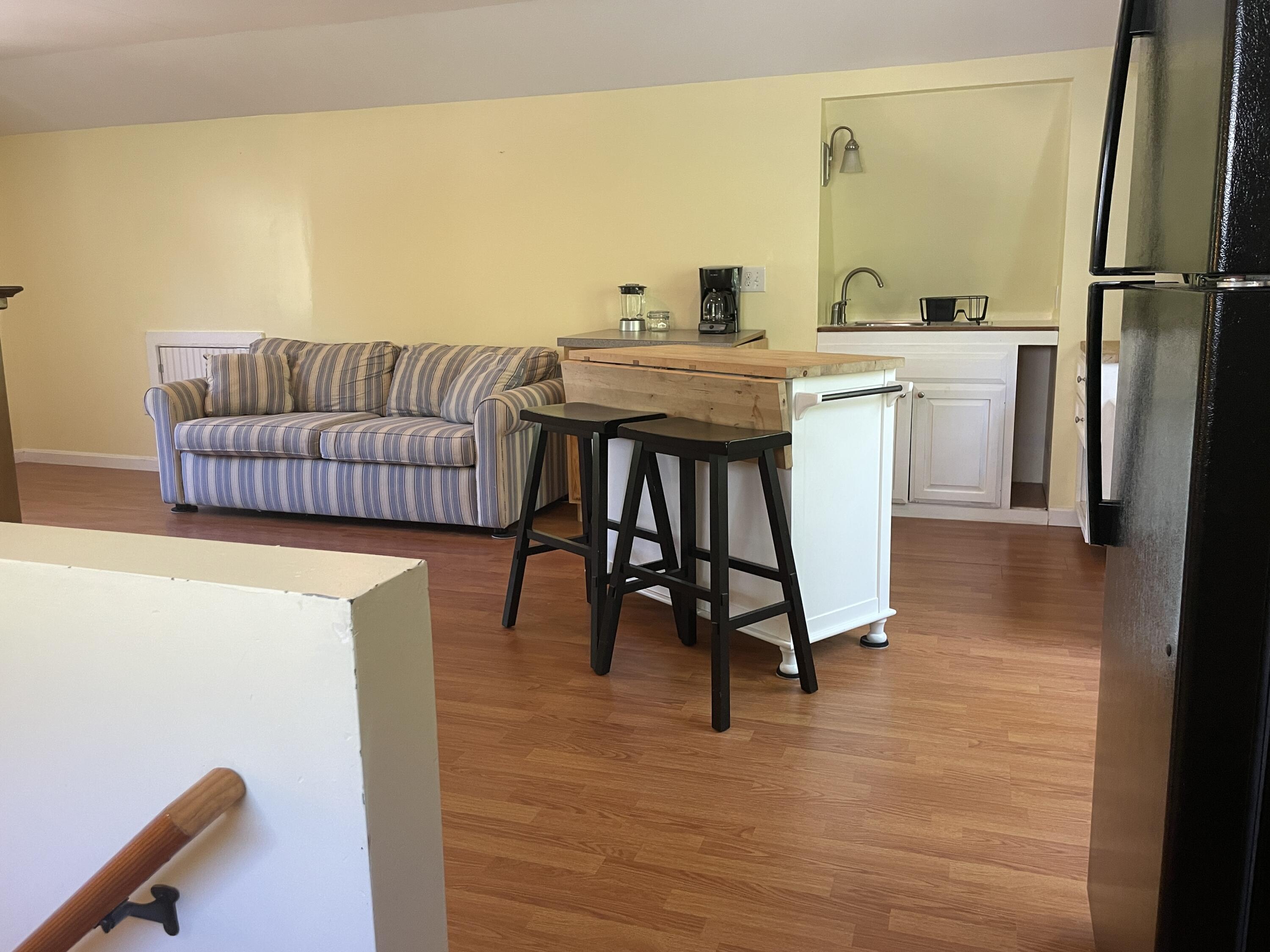 42 Forest Drive Mashpee, MA 02649 - Photo 33 of 55 a living room with a couch and a table