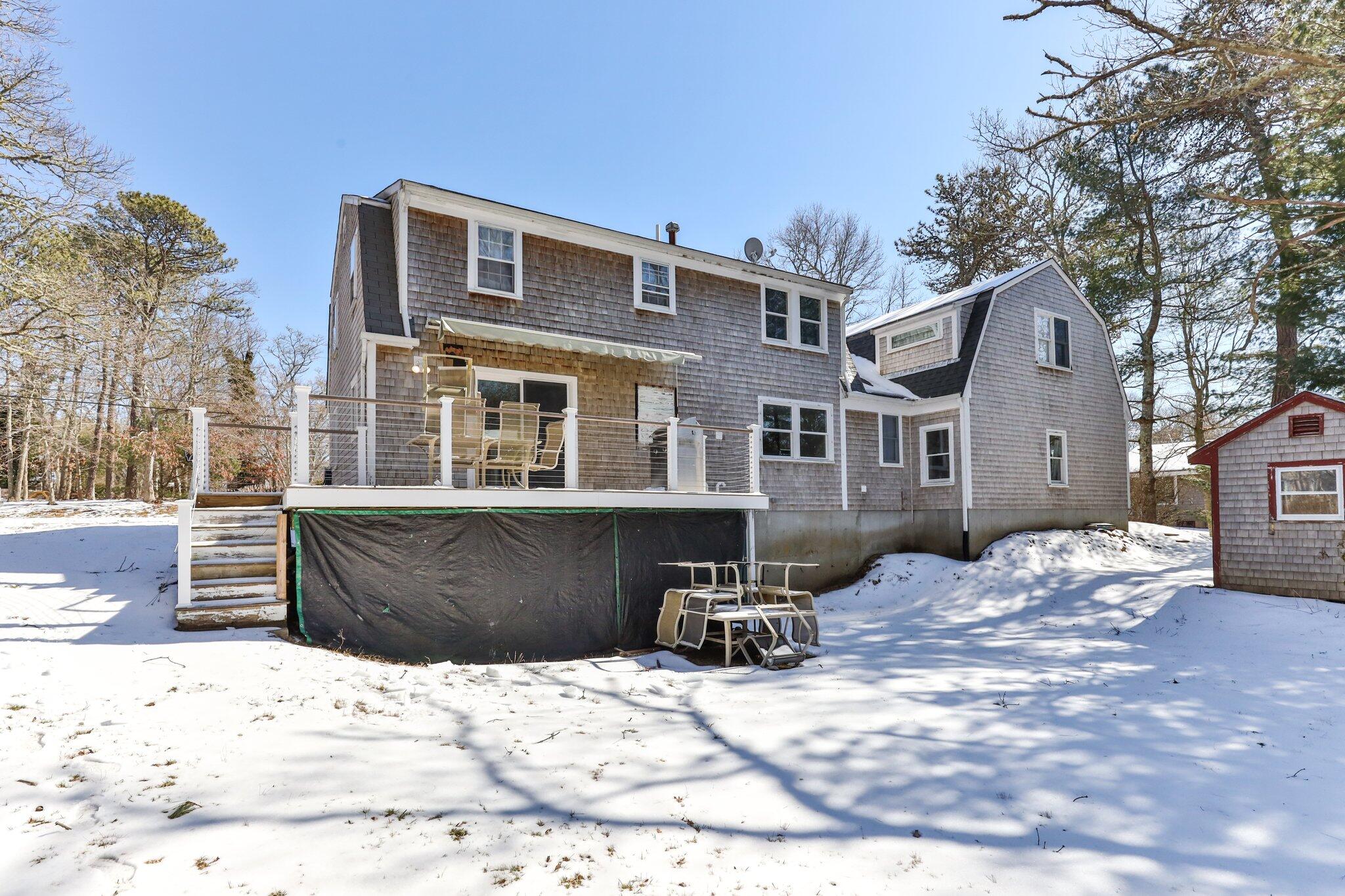 42 Forest Drive Mashpee, MA 02649 - Photo 36 of 55 a view of a house with snow