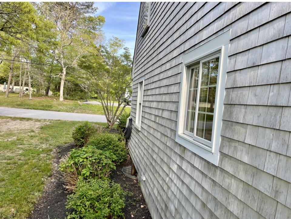 42 Forest Drive Mashpee, MA 02649 - Photo 40 of 55 a view of a house with a yard and large tree