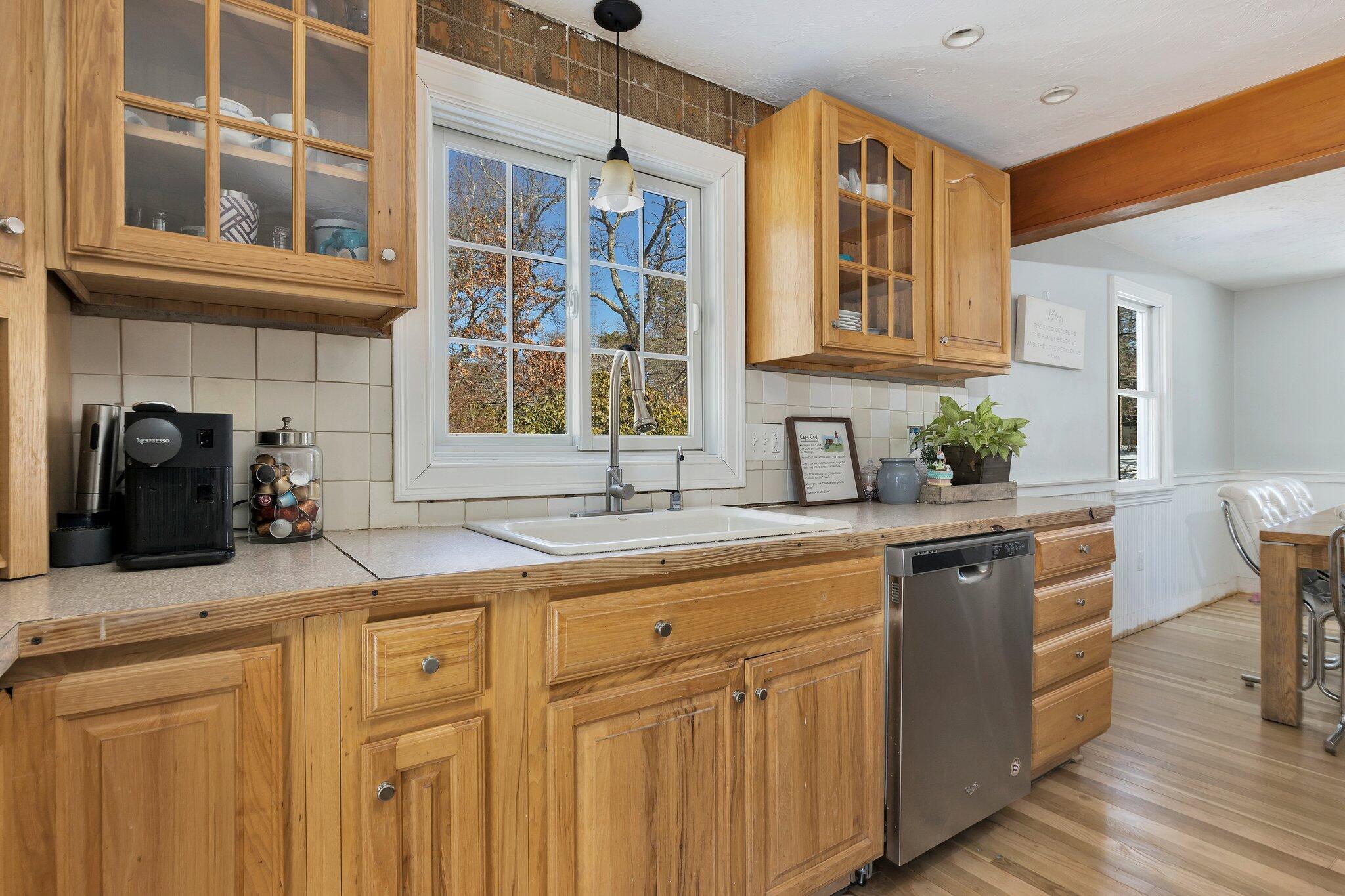 42 Forest Drive Mashpee, MA 02649 - Photo 4 of 55 a kitchen with stainless steel appliances granite countertop a sink and cabinets