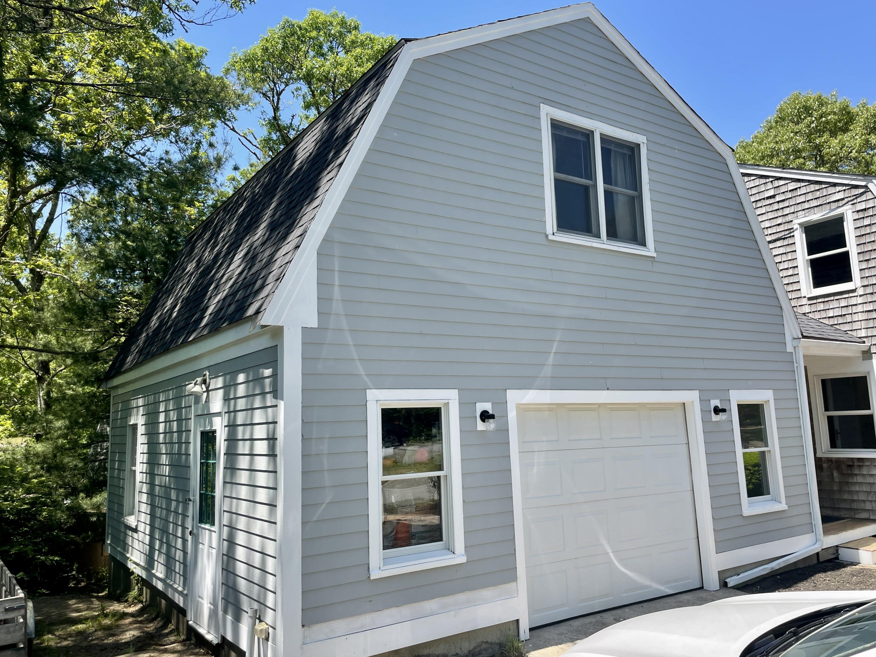 42 Forest Drive Mashpee, MA 02649 - Photo 54 of 55 a front view of a house with a garden