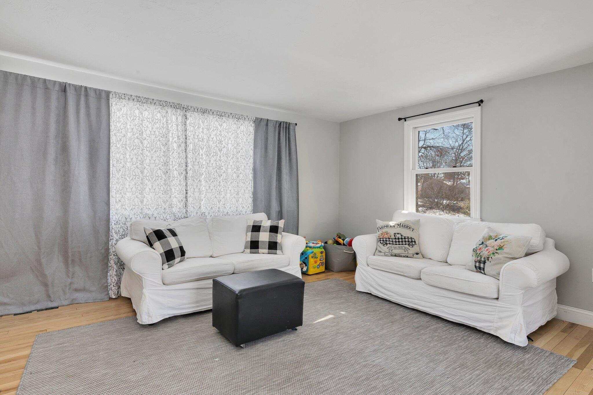 42 Forest Drive Mashpee, MA 02649 - Photo 9 of 55 a living room with furniture and a large window