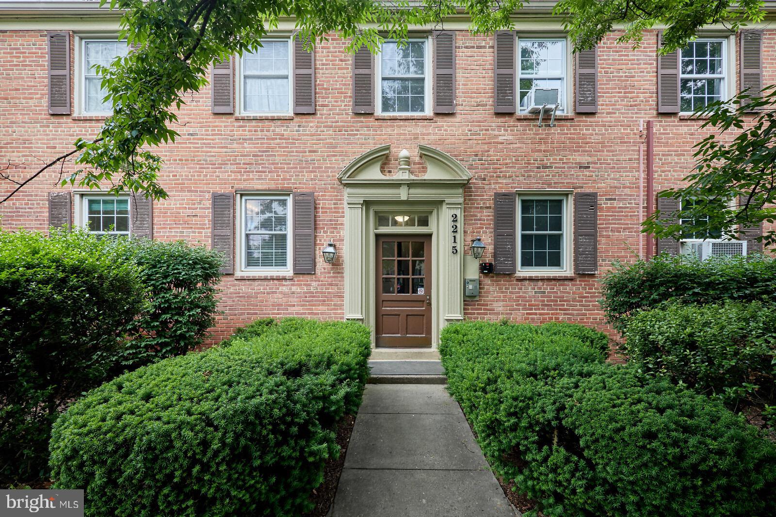 2215 Washington Avenue, Unit 103 Silver Spring, MD 20910 - Photo 1 of 26 front view of a house with a yard