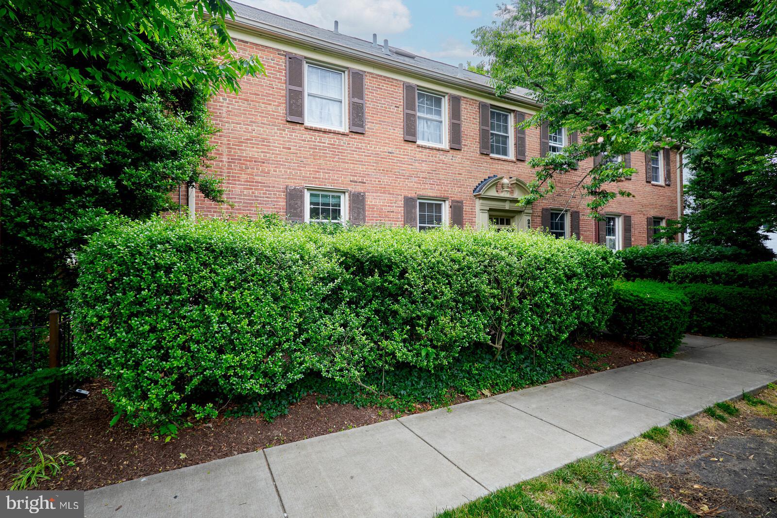 2215 Washington Avenue, Unit 103 Silver Spring, MD 20910 - Photo 20 of 26 a front view of a house with garden