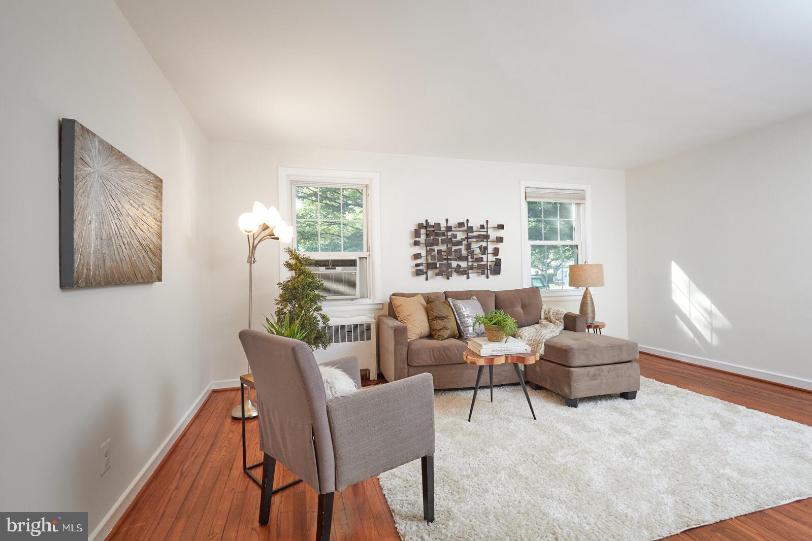 2215 Washington Avenue, Unit 103 Silver Spring, MD 20910 - Photo 3 of 26 a living room with furniture and a window