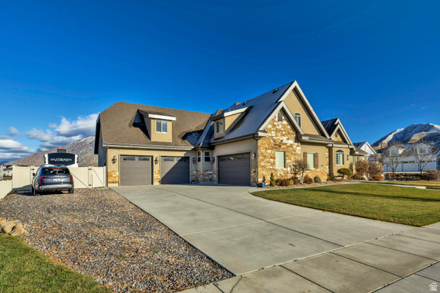 896 West 675 South Mapleton, UT 84664 - Photo 66 of 77 Craftsman-style home featuring concrete driveway, a mountain view, stucco siding, an attached garage, and a gate