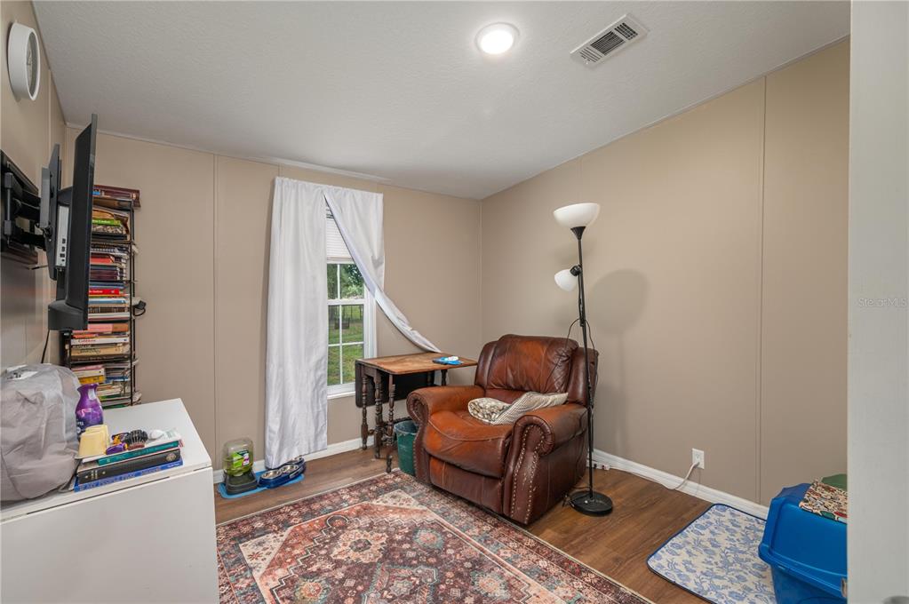15079 Brahma Road Polk City, FL 33868 - Photo 28 of 40 a living room with furniture and a window