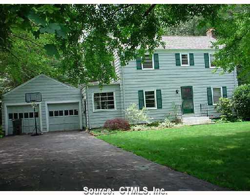 17 Longlane Road West Hartford, CT 06117 - Photo 1 of 1 a front view of a house with a yard and garage
