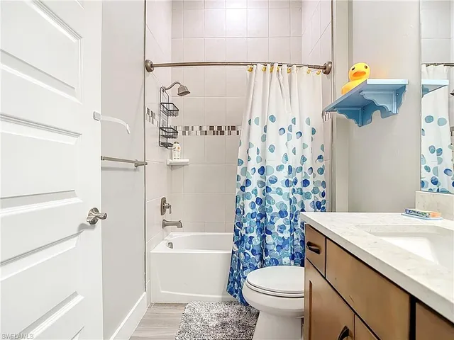 a bathroom with a sink a toilet and a bathtub