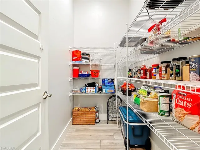 a utility room with stainless steel appliances and a window