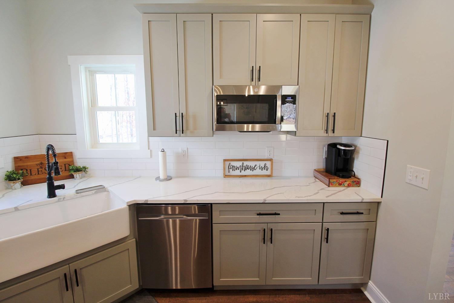 45 Langdon Road Evington, VA 24550 - Photo 26 of 74 a kitchen with white cabinets and sink