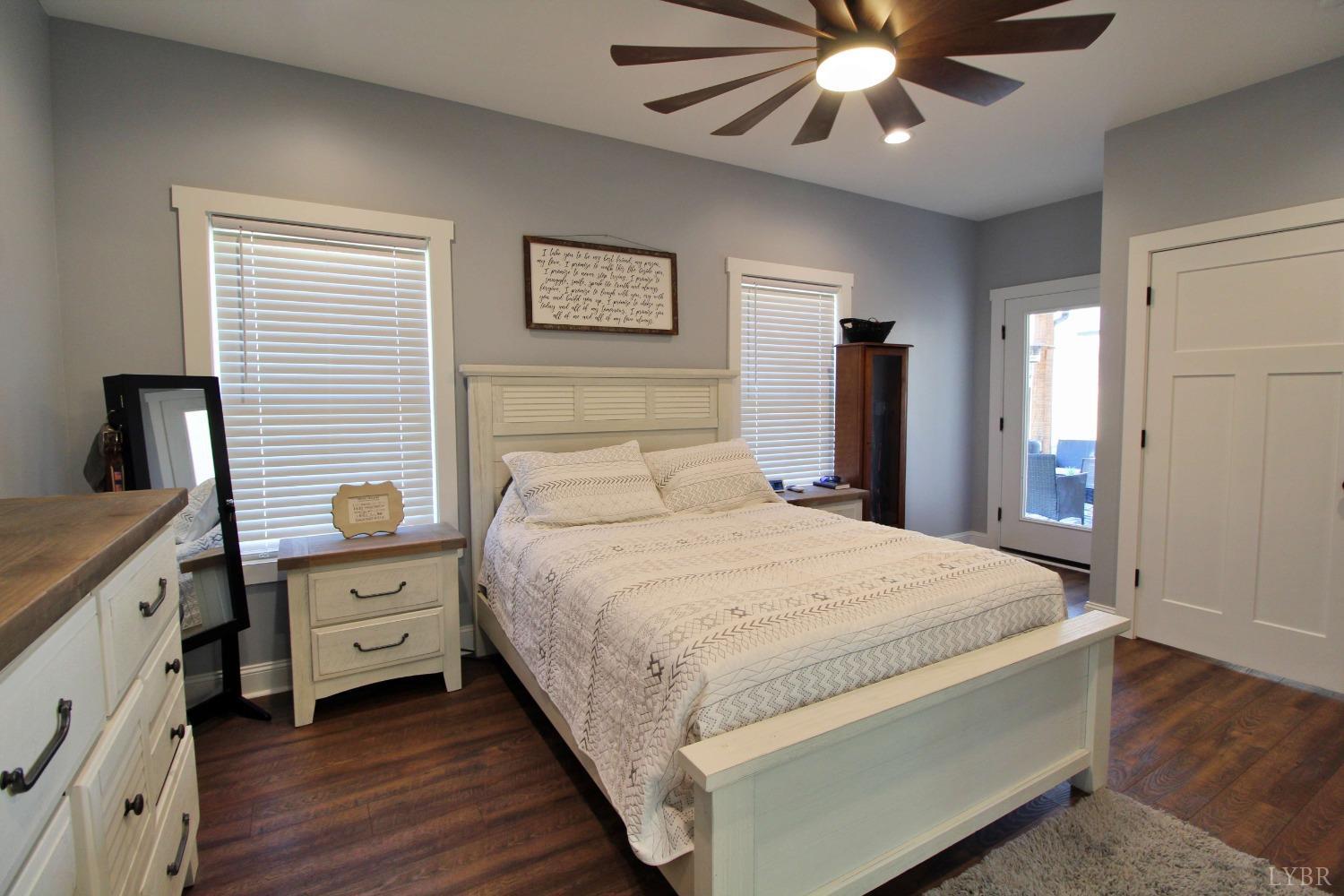 45 Langdon Road Evington, VA 24550 - Photo 36 of 74 a bedroom with a bed and a chandelier