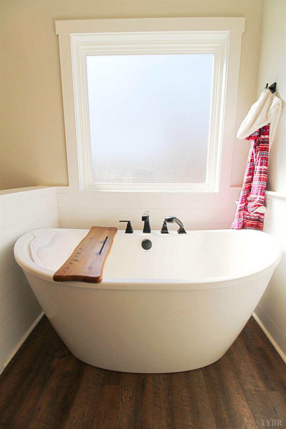 45 Langdon Road Evington, VA 24550 - Photo 40 of 74 a white bath tub sitting in a bathroom