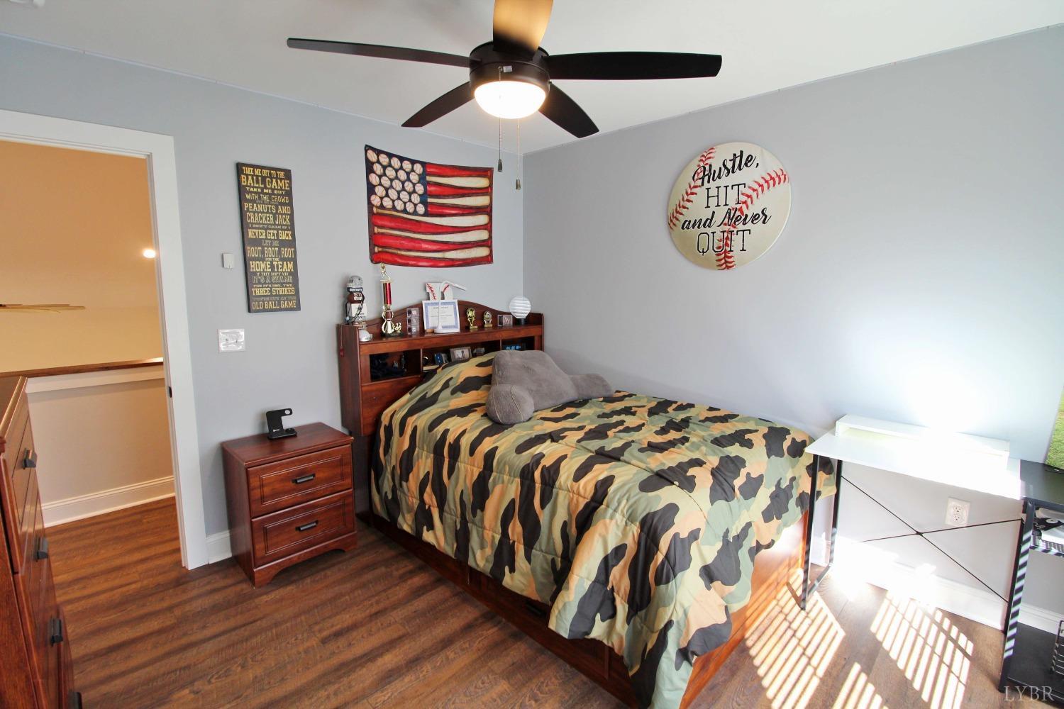 45 Langdon Road Evington, VA 24550 - Photo 57 of 74 a bedroom with a bed and a chandelier