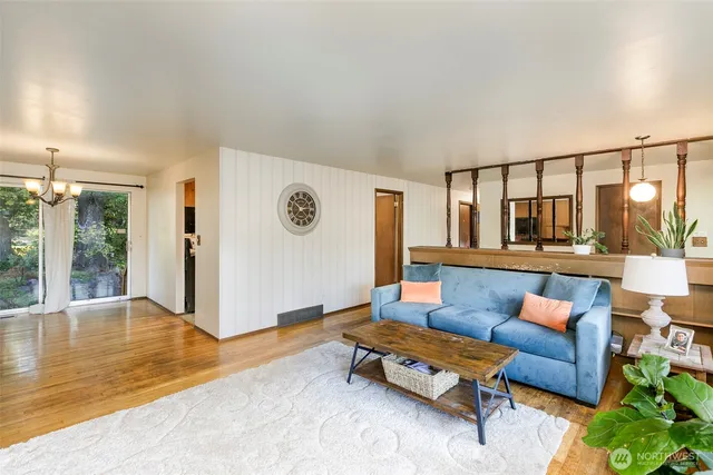 a living room with furniture and a table