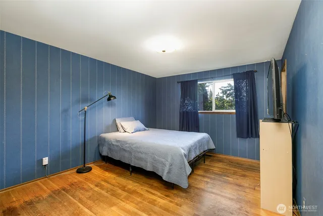 a bedroom with a bed and a dresser