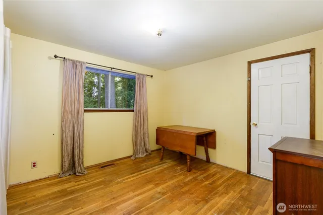 a view of a bedroom with closet area