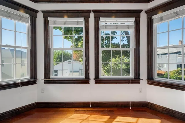 a view of a bathtub in a room with a large window