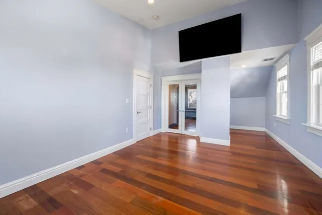 a view of a livingroom with wooden floor