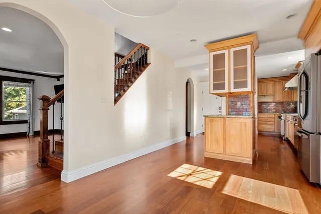 a view of livingroom with hardwood floor and stairs