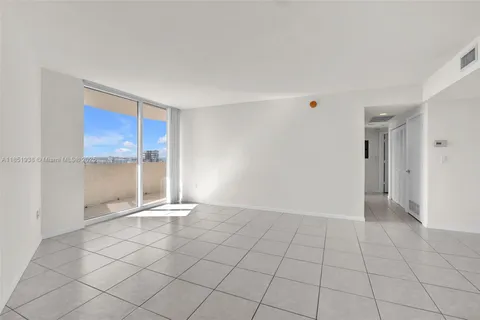 a view of an empty room and window