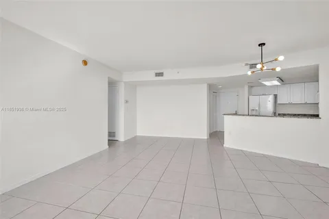 a view of a kitchen with marble kitchen and granite countertop white cabinets