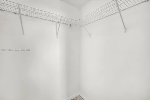 a view of storage and utility room with washer and dryer