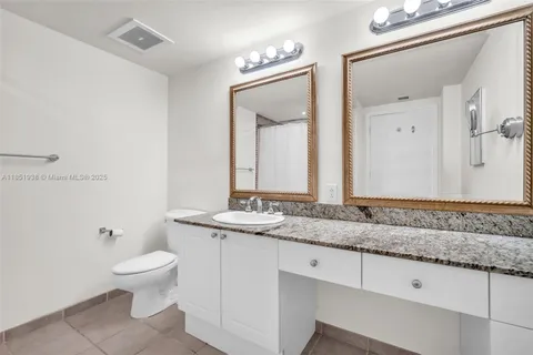 a bathroom with a shower and a toilet