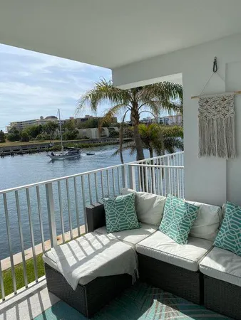 a view of a balcony with furniture