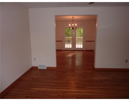 242 Lytton Road Coraopolis, PA 15108 - Photo 7 of 18 Living Room. A great flow of living room to dining room with same elegant hardwood flooring. Newer French doors in dining room lead to Trex deck.
