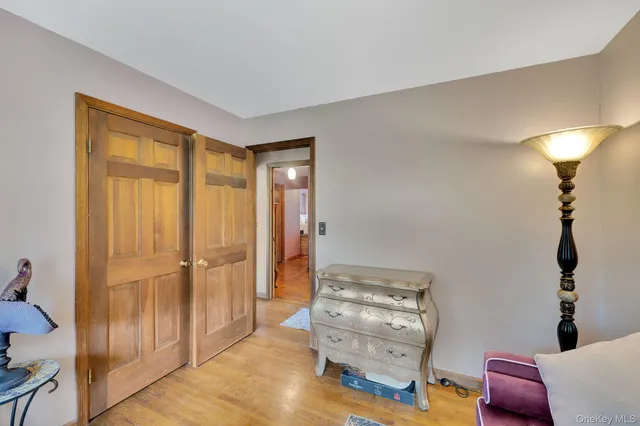 a view of room with hardwood floor and cabinet