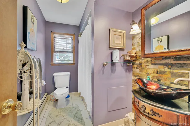 a bathroom with a toilet and a sink