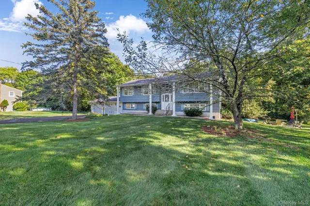 a view of a house with a back yard