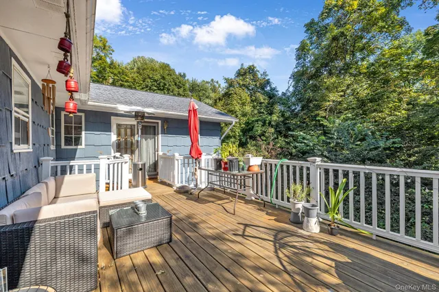 a view of a chair and tables in the balcony