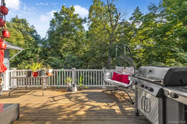 a view of a chairs and table on the wooden roof