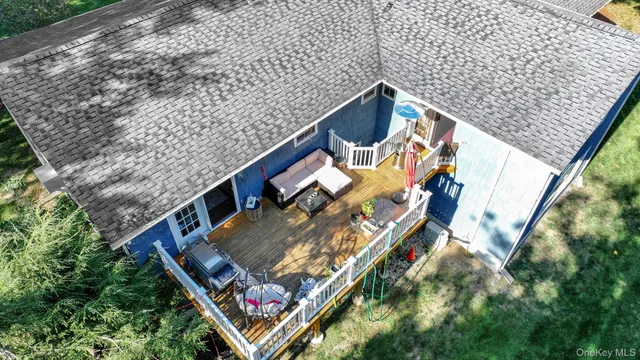 an aerial view of a house with a yard