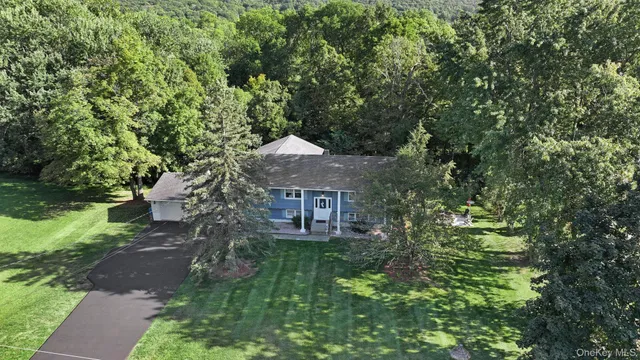 a aerial view of a house with a yard