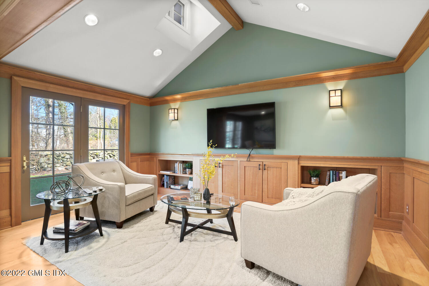 7 Owenoke Way Riverside, CT 06878 - Photo 16 of 37 a living room with couches and a flat screen tv