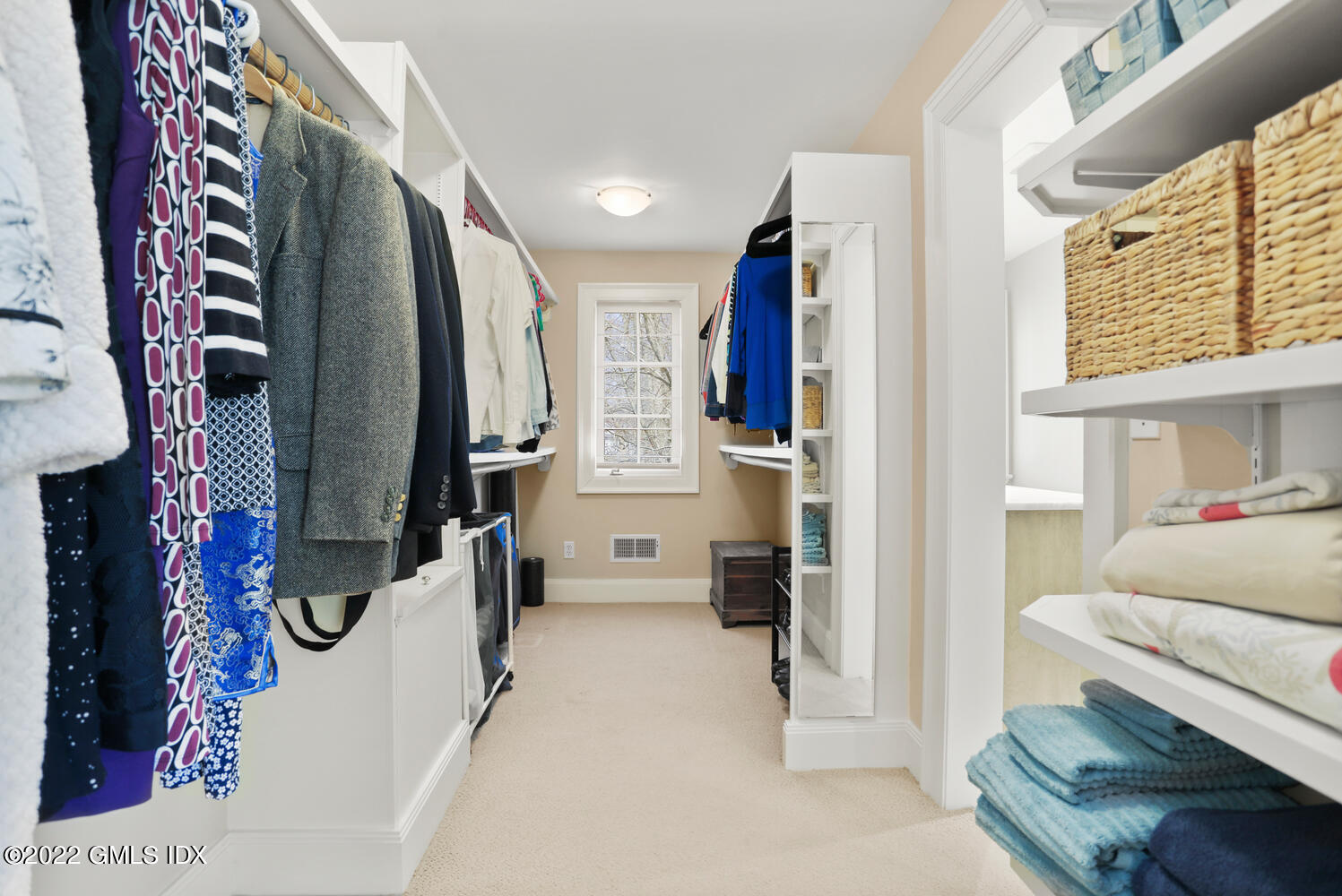 7 Owenoke Way Riverside, CT 06878 - Photo 21 of 37 a view of walk in closet with clothes and shoes