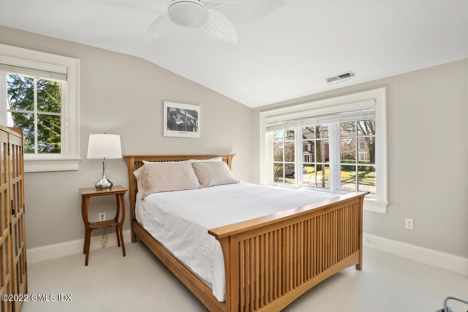 7 Owenoke Way Riverside, CT 06878 - Photo 27 of 37 a bed sitting in a bedroom next to a window